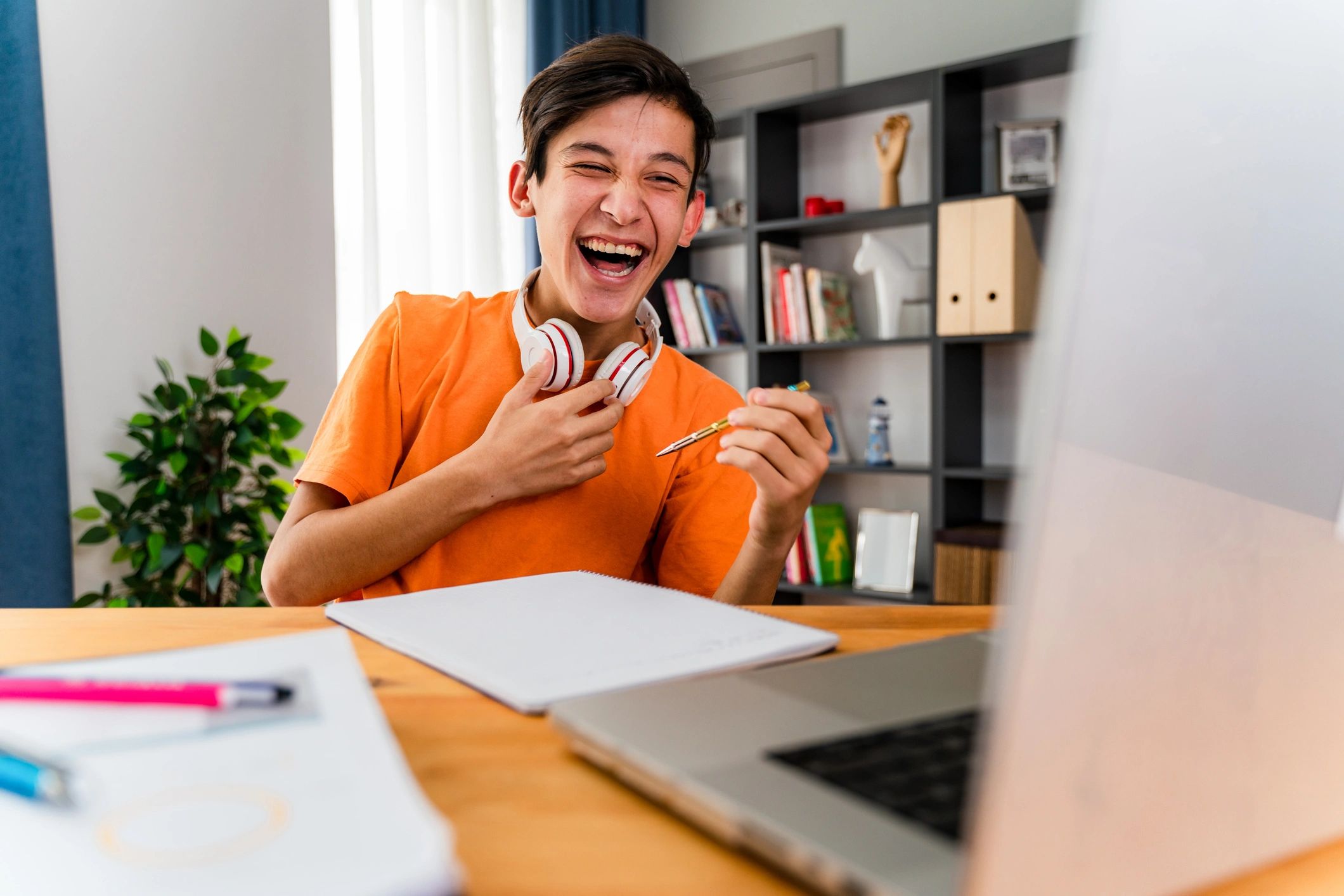 Student attending an online tutoring session on a laptop