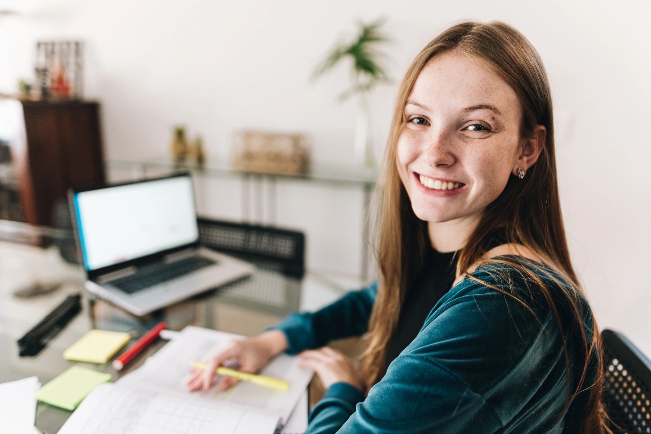 Student studying at a desk at home